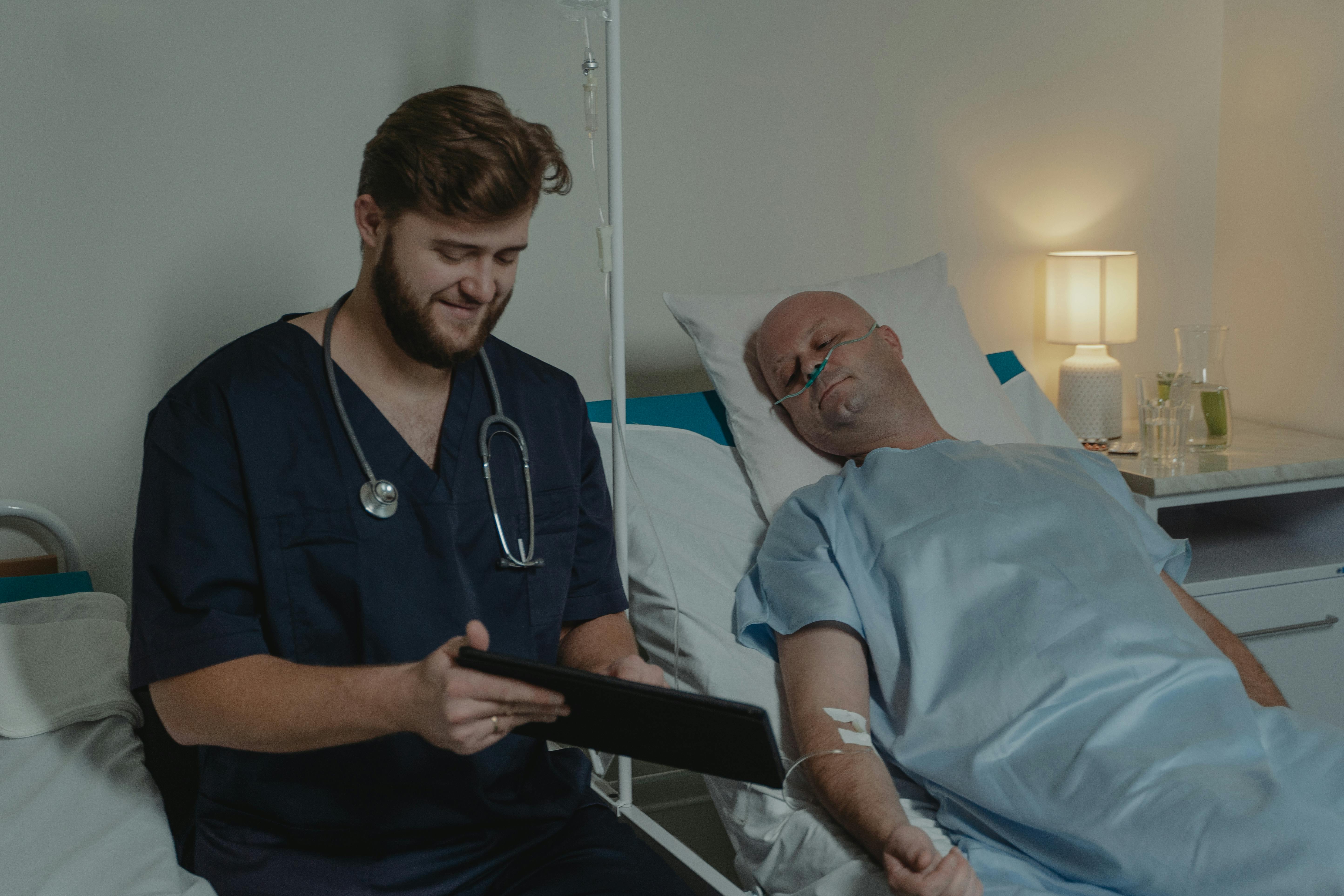 A nurse supporting a patient during a consultation