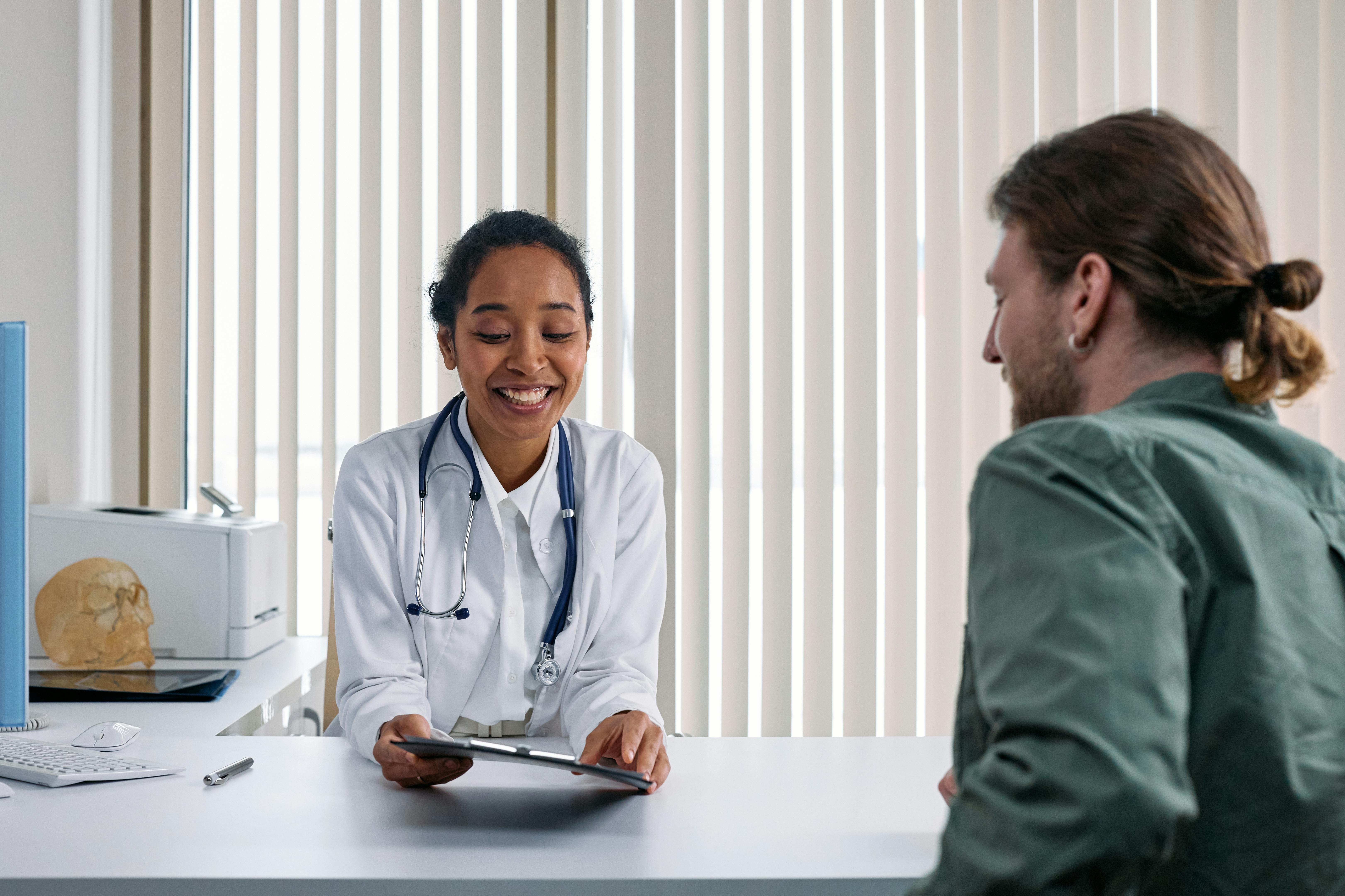A clinician discussing care with a patient